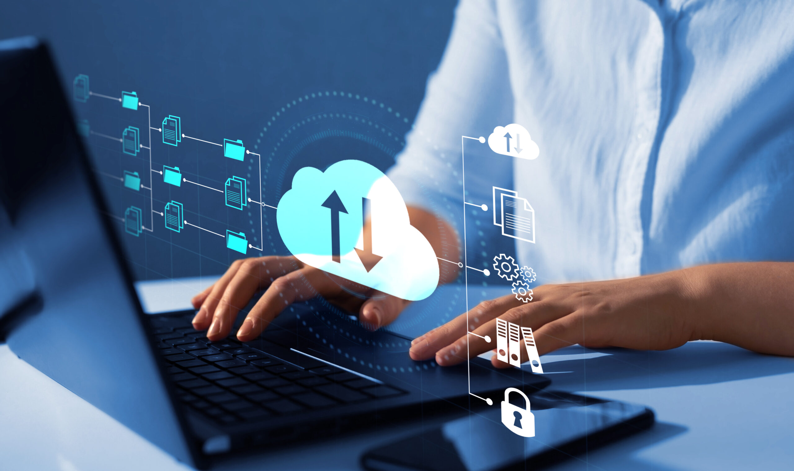 A person working on a laptop with digital icons representing cloud computing, file sharing, and data security superimposed over the image.